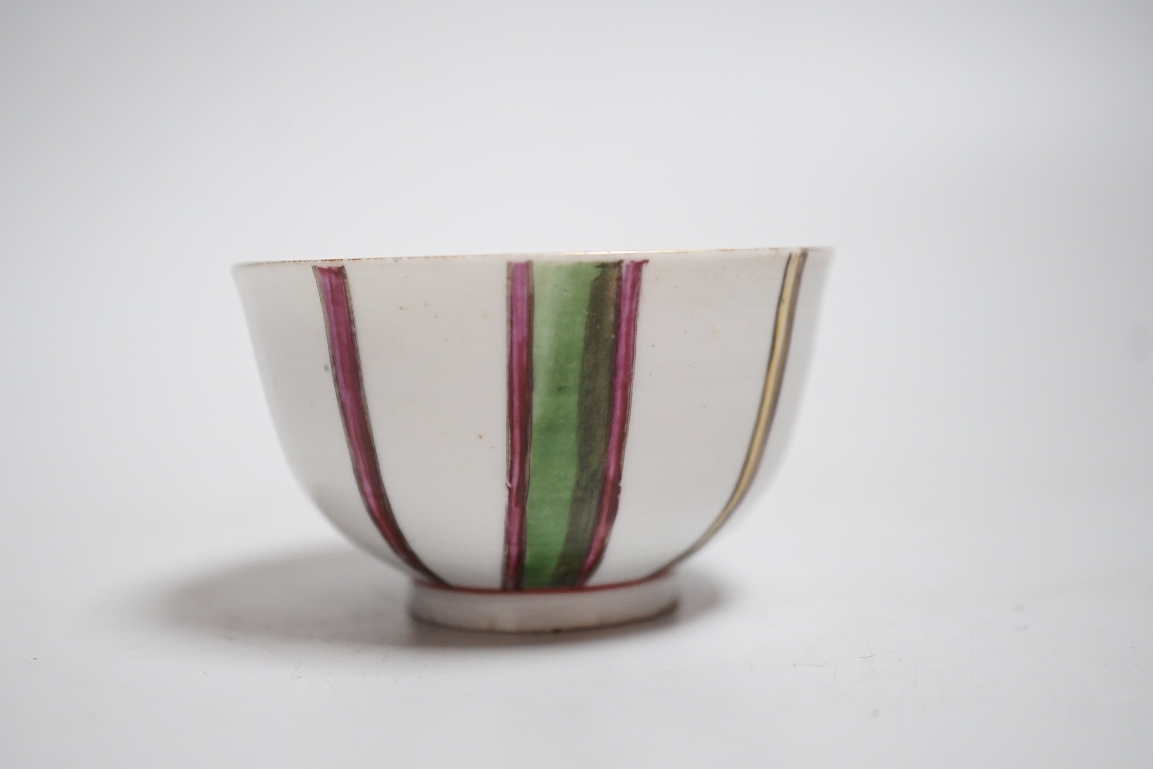 A Venice, Cozzi porcelain teabowl with polychrome vertical stripes, c.1765, 7.3cms diameter